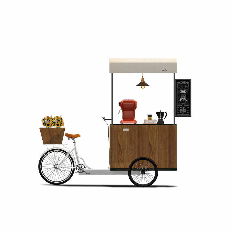 Movable coffee tricycle with espresso machine and display counter.