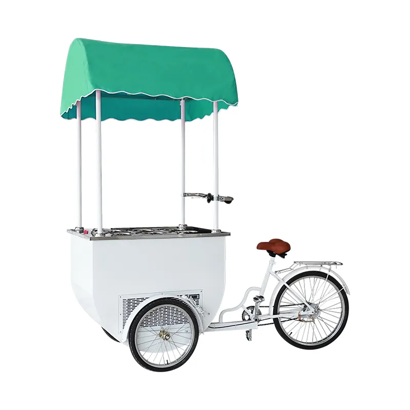 Mobile ice cream vending tricycle with canopy and freezer options.
